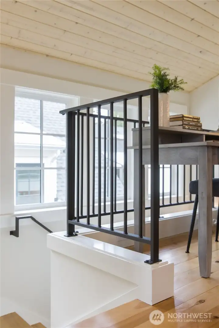 At the top of the stairs is a cozy nook for office and computing.