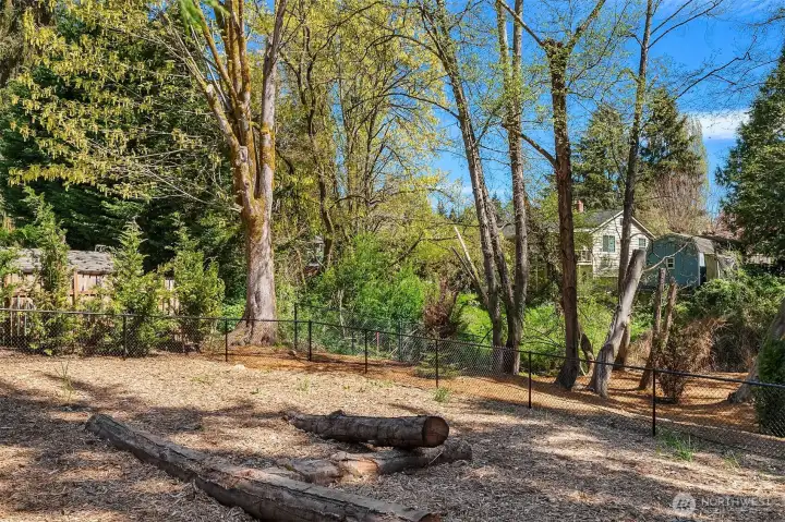 A fenced, off leash dog area is included in the one and one half acre open space.