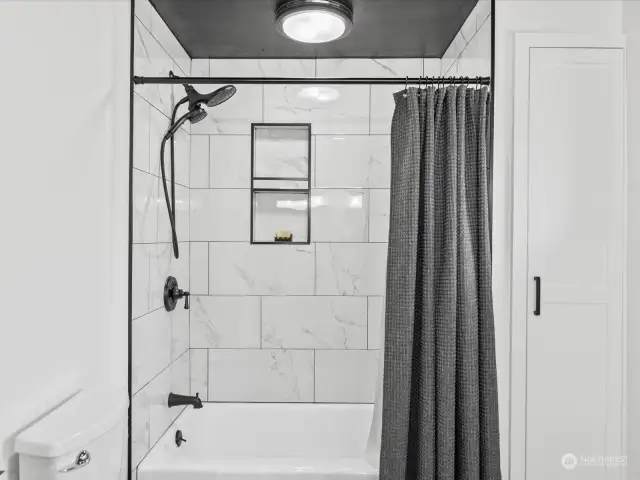 Custom tile surround in the shower.