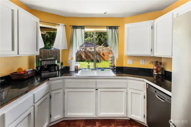 Kitchen has a large window above the sink that peers into the backyard and lets in tons of light.