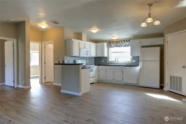 Clean, bright and functional!  Newer LVP flooring throughout the home.