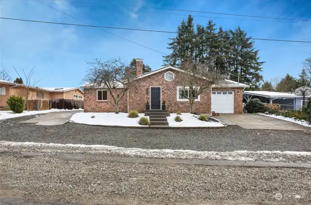 Brick façade adds charm and character for this gorgeous home on a quiet dead-end street.