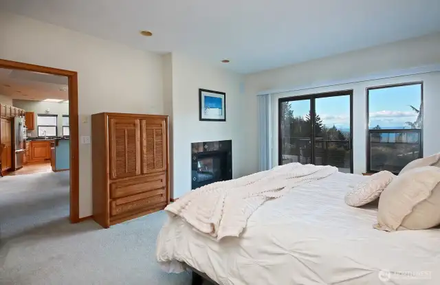 Your Primary Suite is located off of the Living Room. Entrance to your spacious bathroom is behind you. Propane double sided fireplace is shared with the Living Room.