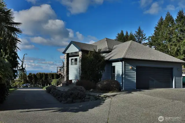 Two-car garage, mature landscaping, and located at the end of the road.