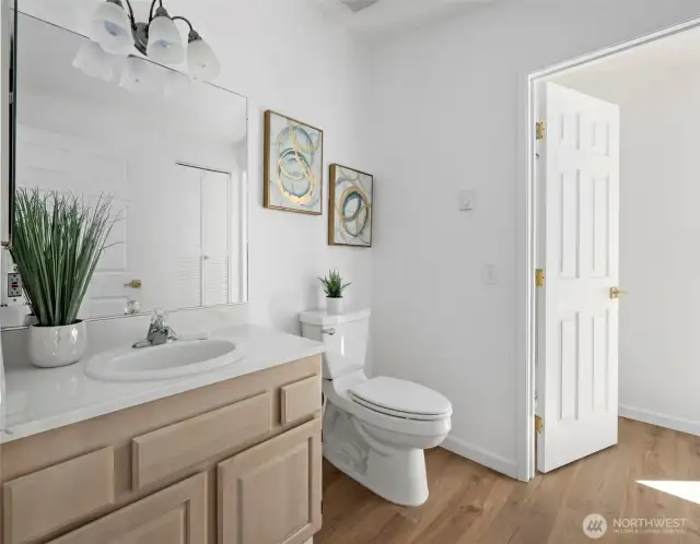 Maint Floor guest bathroom on the main level includes a separate shower attached to the second bedroom.