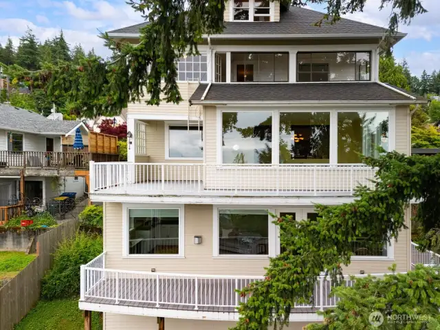 Looking at the back of the home. These windows and decks all have dynamic views of Bellingham Bay, the San Juan Islands and north to the Canadian Coastal Range.