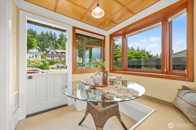 Exterior entry with a Dutch door on the street, east, side of the breakfast room. There's a deck on the west side with gas for a BBQ.