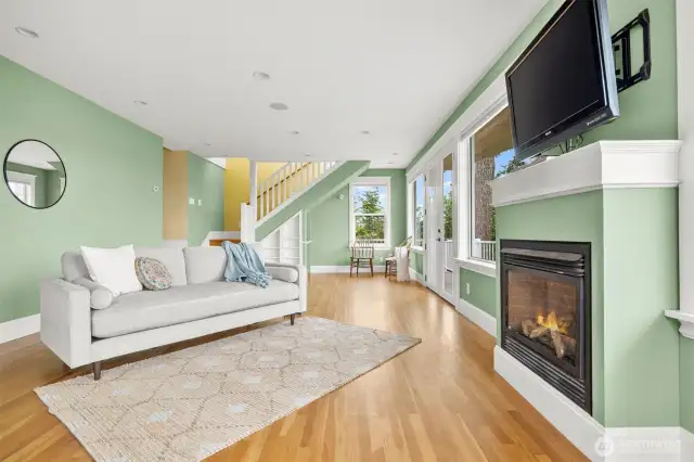 Stairway form the 1st floor leads down to this family or recreation room with a gas fireplace. When the owner purchased the home this area had an indoor swimming pool. Yes, really!