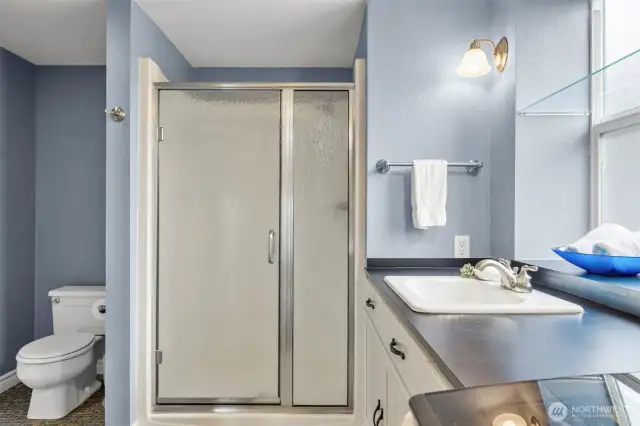 Modern 3/4 bath with laundry.