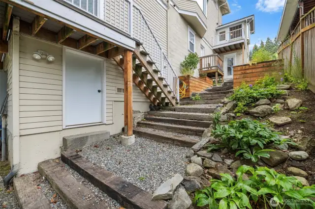 South side of the home. This door opens to the lower basement. Newer concrete foundation resulted in this additional basement.