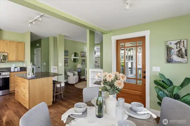 The luxury glass and cedar entry door opens to the dining area and kitchen.