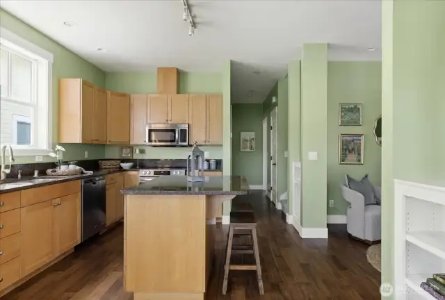 Large, granite topped island for your convenience with room for eating at the bar.