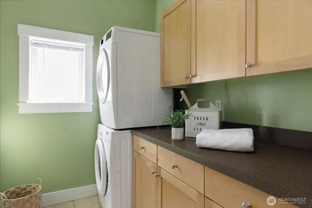 Large laundry room with pantry options or more storage just down the hall from the kitchen.
