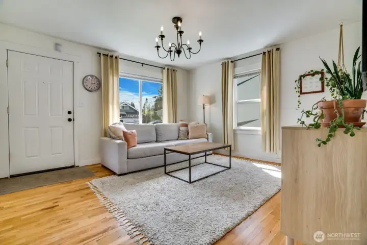 Each room is well lit. Windows are outfitted with both custom blinds and curtains.