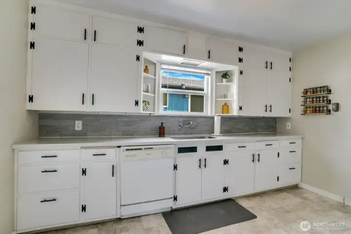 kitchen is spacious and newly refreshed: new Quartz Countertops and freshly painted.