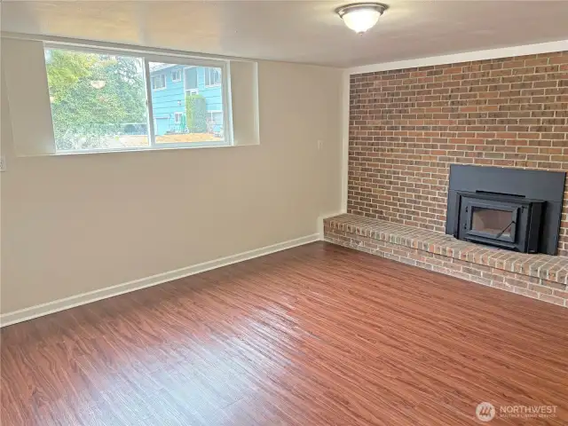 Basement family room in the fully finished lower level at 16312 127th Pl SE, Renton—updated with fresh paint and new flooring; flexible space in Cascade 98058.
