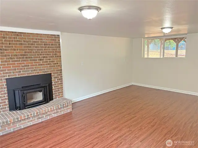 Lower-level family room showcasing the spacious, finished basement—ideal flex area for media, office, or hobbies at 16312 127th Pl SE, Renton WA 98058.