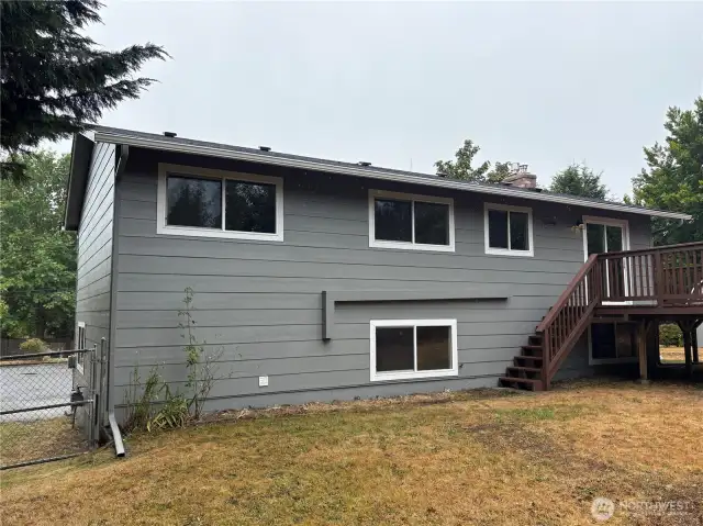 Open backyard with room for garden beds, play, or pets (buyer to verify use)—quiet setting in Cascade, Renton 98058.