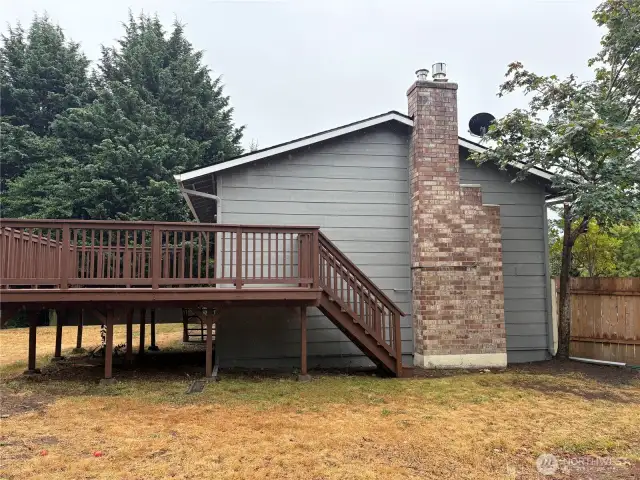 Open backyard with room for garden beds, play, or pets (buyer to verify use)—quiet setting in Cascade, Renton 98058.