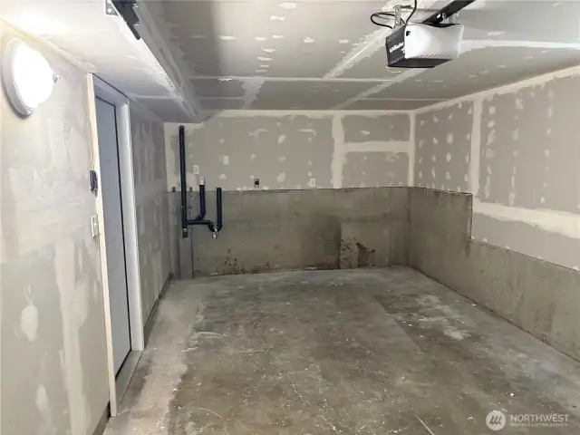 Attached single-car garage—extra-deep bay for tools and equipment at 16312 127th Pl SE, Renton (Cascade 98058).