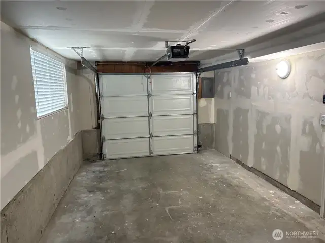 Interior view of the extra-deep garage showing parking plus workspace/storage potential—updated split-level in Cascade, Renton WA 98058.