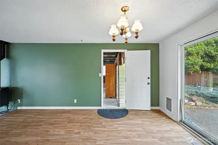 View from eating area to door to 2-car carport