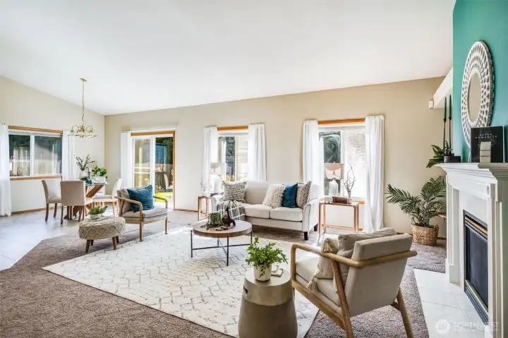 Sunlight streams into the main living spaces, enhancing the home's open and airy feel.