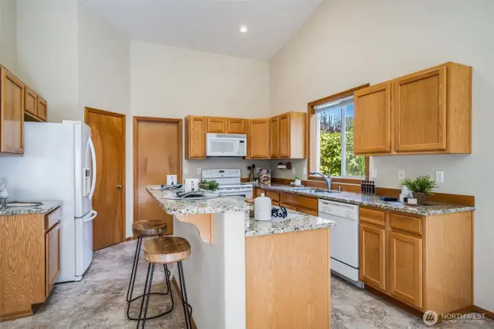 Functional kitchen island with built-in eating space, perfect for casual meals and quick bites.