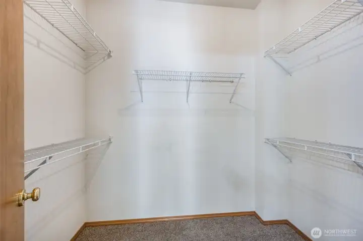 Plenty of room for your wardrobe in this primary walk-in closet.