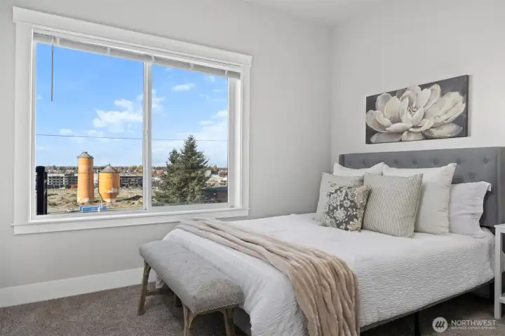 Primary bedroom with water & park views