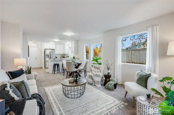 Multiple windows on this end unit provide ample natural light throughout this great room concept.