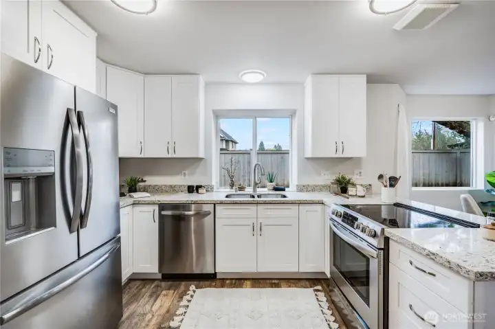 The home chef will fall in love with this new kitchen! All new, white, soft close cupboards provide plenty of storage space.