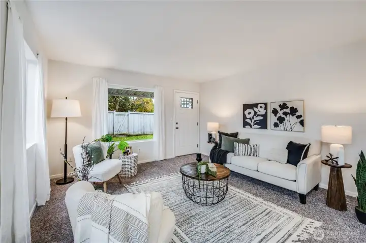 Come relax in this inviting living room, with a door that opens to the fenced backyard.