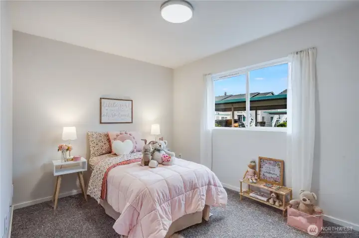 The second bedroom of the home can be a home office, kids' room, guest room, or storage area. It overlooks the front of the condo.