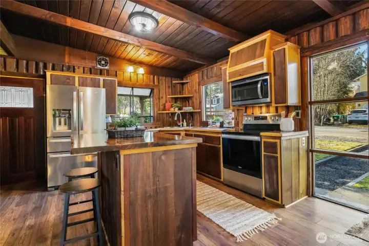 Open concept kitchen with stainless appliances