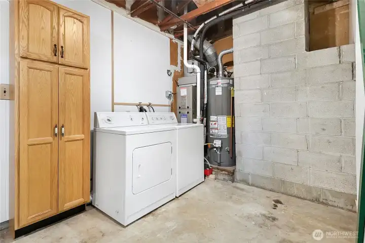 The laundry area is located outside the main house. The homeowners installed a sliding door between the laundry and the garage itself, which you can see in the next image.