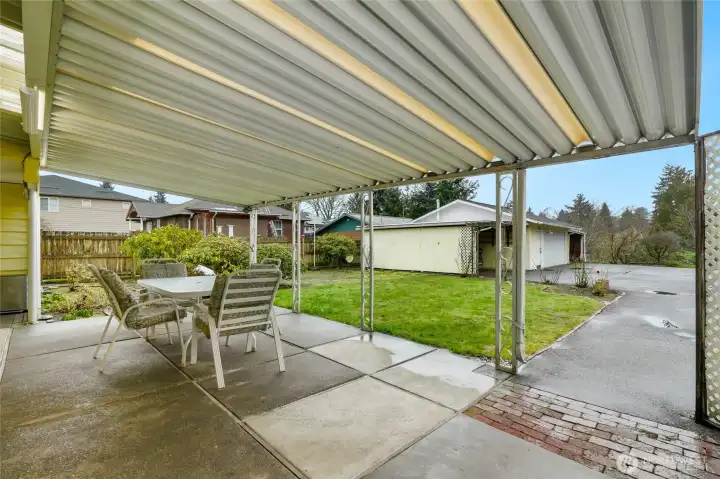 Entertainment sized covered patio with loads of covered parking and additional onsite parking
