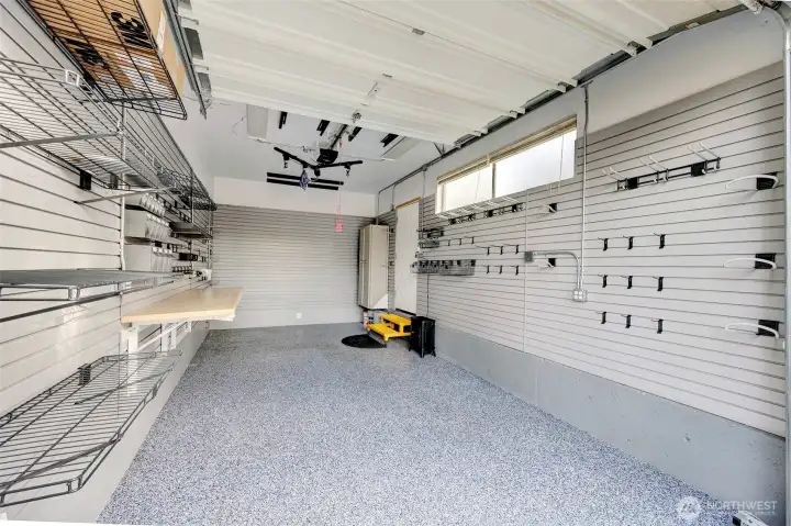 Extra deep garage with bike hoist/rack, heater, and modular storage solutions.