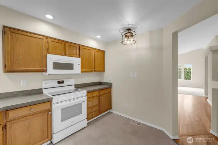 The kitchen is easily accessible from the dining and living areas.