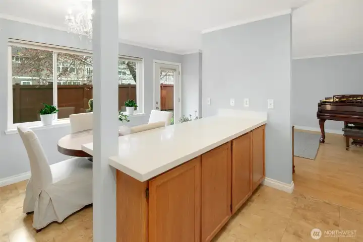 Kitchen island provides a breakfast bar and ample counter space.