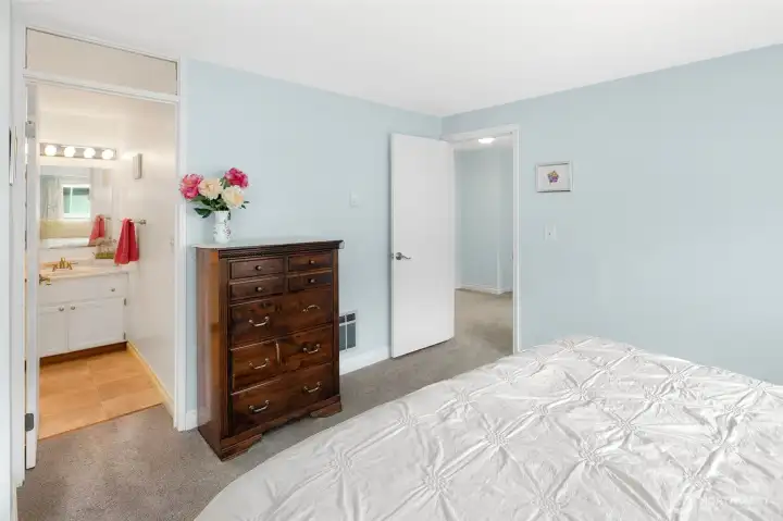 Primary bedroom includes an attached 3/4 bath.