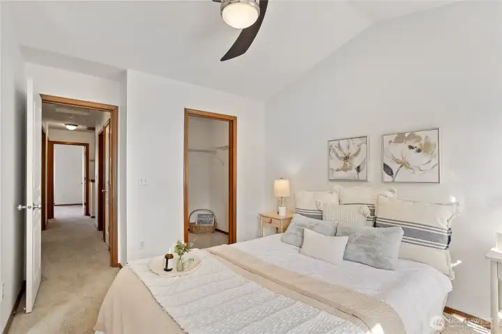 Primary bedroom with walk-in closet