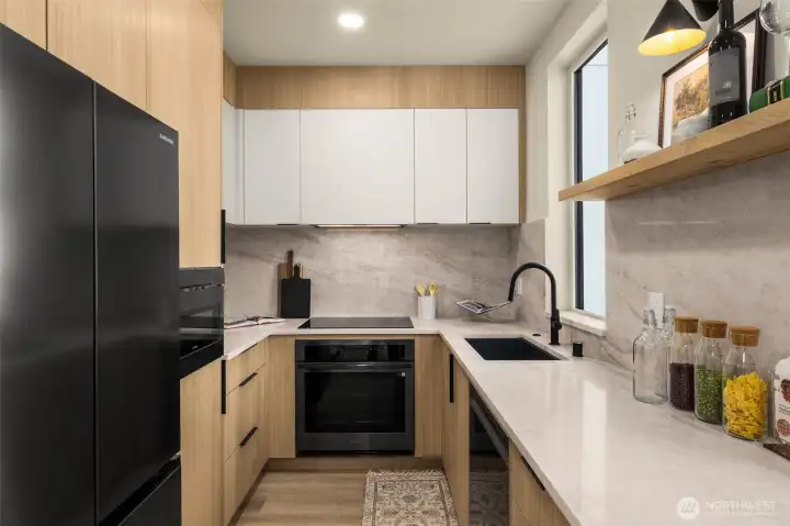 Bright and airy kitchen design with custom shelving and minimalist industrial hardware.