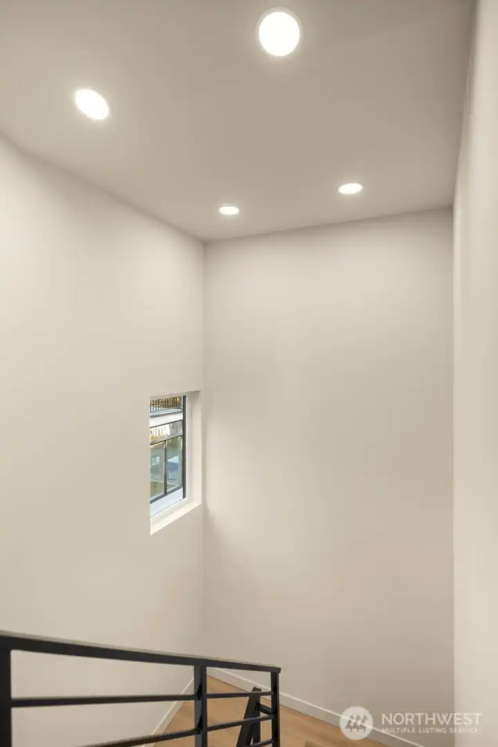 Dedicated laundry area with streamlined storage solutions and modern utility features.