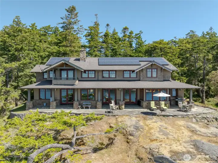 This custom NW Craftsman sits on 27 waterfront acres with southern, territorial views all the way to the Olympic Mountains.