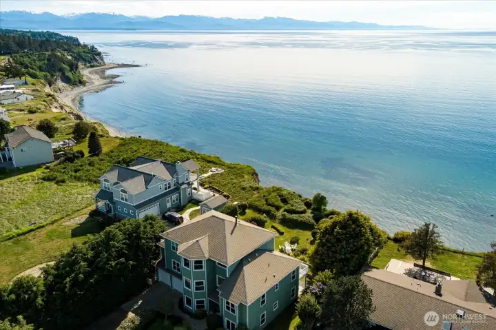 The home's amazing views incorporate the Olympic Mountain range, and the shipping and cruise boat traffic that goes up and down the Puget Sound.