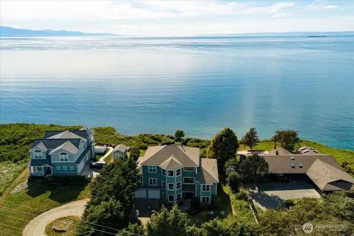 The home commands a wonderful location with vast water and mountain views.
