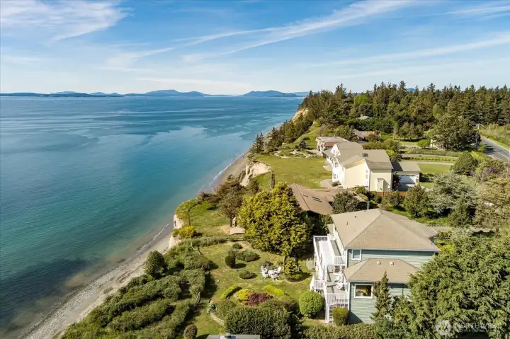 The home sits back from the bluff overlooking the Puget Sound and the San Juan Islands in the distance.