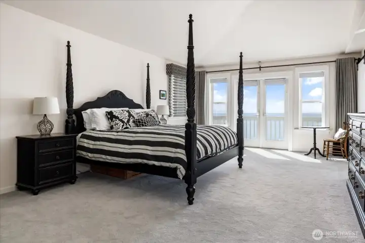 Spacious Primary Ensuite that can accommodate a King-size bed, with French doors out to the private deck. Very large Walk-in Closet with floor-to-ceiling built-in cabinetry.