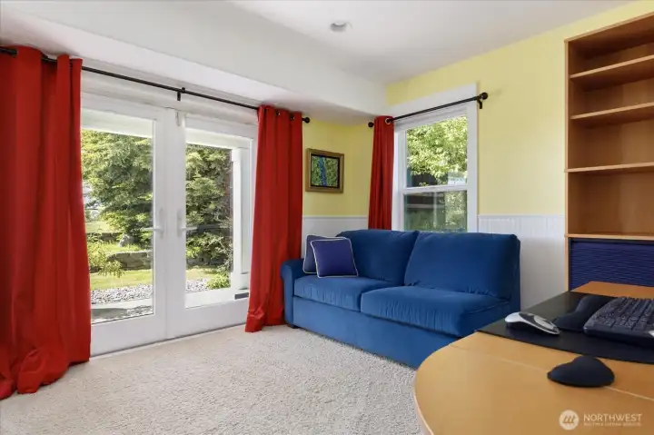 The private office on the lower level has plush carpeting, beadboard walls, and French doors out to the backyard patio, with views of the water & mountains. Adjacent to the office is a large storage closet area with access to the 2-car garage.